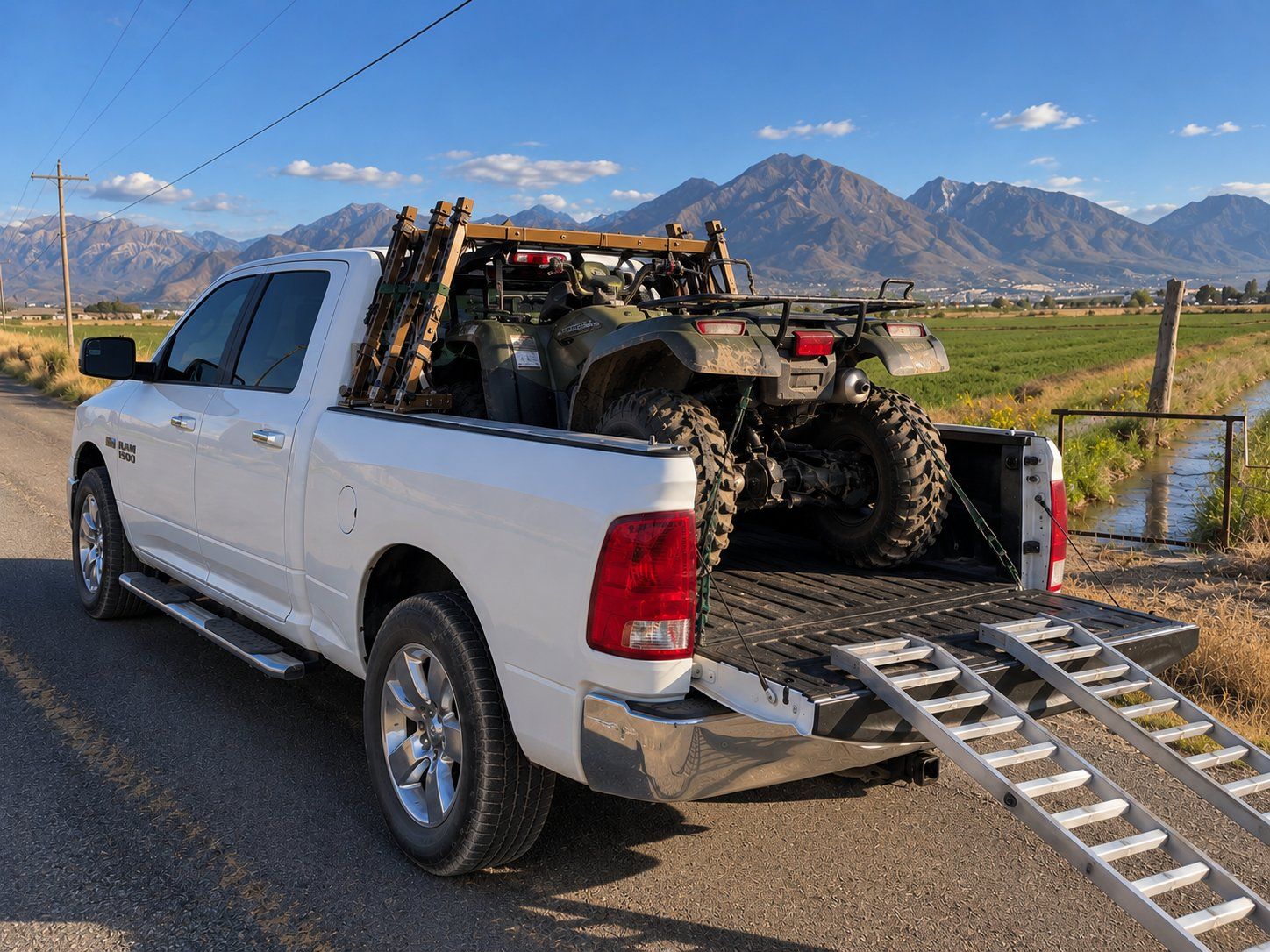 ATV loaded into the bed with ramps